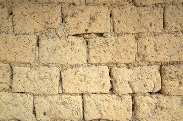 old yellow mud brick wall background