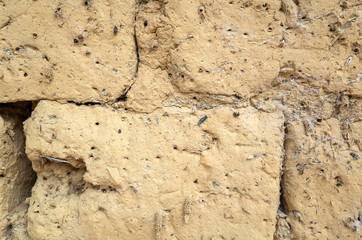 old yellow mud brick wall background