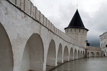 Tobolsk Russia, Kremlin wall with arches on a wet overcast day © KarinD