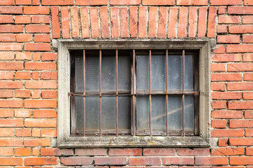 old window on red brick wall