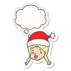 cartoon girl wearing christmas hat and thought bubble as a printed sticker
