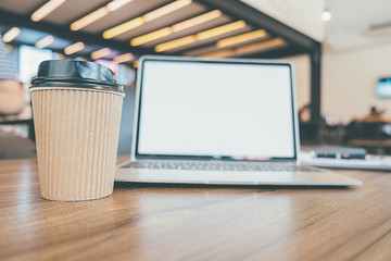 A laptop is placed on table with blank screen computer modern
