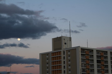 The Moon and an apartment building