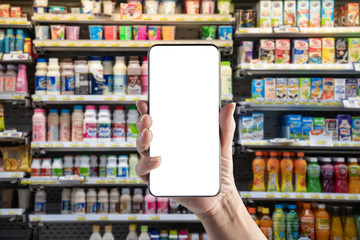 Hand-held mobile phone in supermarket