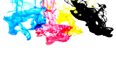 cmyk ink concept color splash for paint with cyan blue red magenta yellow and black - Rainbow ink drop Acrylic colors in water on white background , blur and selective focus