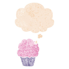 cartoon cupcake and thought bubble in retro textured style