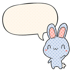 cute cartoon rabbit waving and speech bubble in comic book style