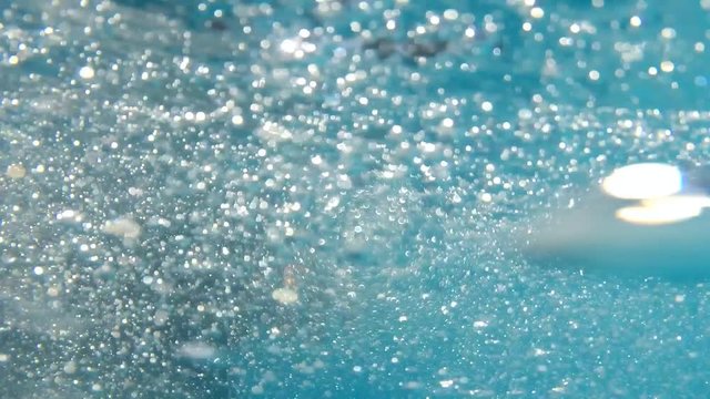 in the pool sinking boy in clothes with glasses