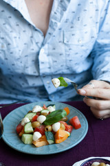 A gourmet lunch: a salad and various appetizers.