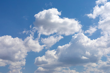 Fototapeta na wymiar Blue sky and white, fluffy clouds