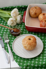 A healthy lunch: baked apples with honey on side.