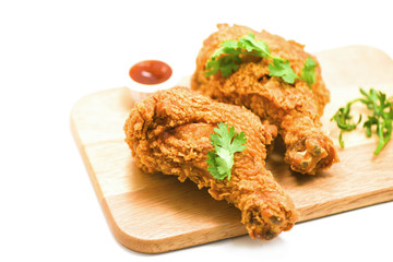 Fried chicken crispy on plate wooden board with ketchup on white