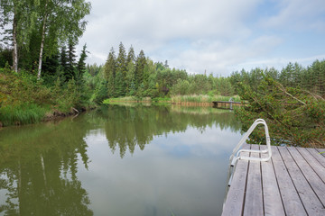 City Amatciems, Latvian republic. A clean lake and surrounded by green nature. Recreation area for...