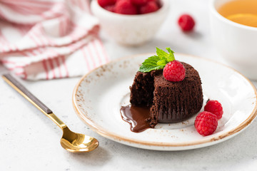 Tasty Chocolate Dessert Fondant Or Lava Cake With Fresh Raspberries. Closeup View