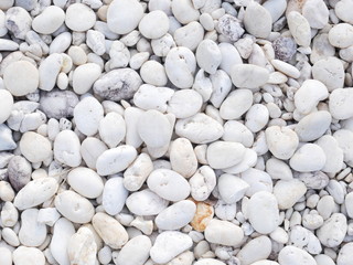 Fototapeta na wymiar white stone background, closeup beauty pebble beach stone