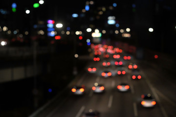 Fototapeta na wymiar Bokeh blur of traffic lights in city at night
