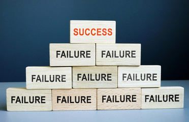 Success and failure concept. Career staircase from wooden blocks.