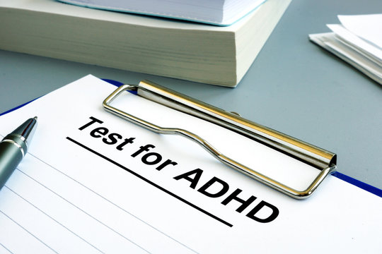 Test for ADHD form with pen and clipboard.