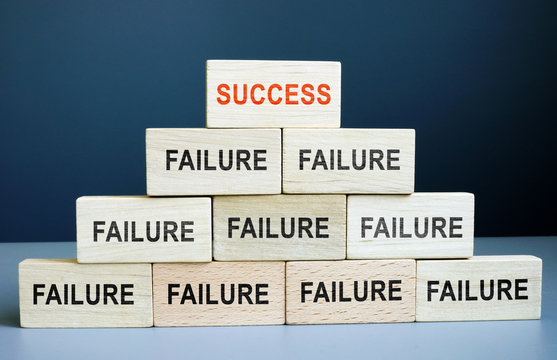 Success and failure concept. Career staircase from wooden blocks.