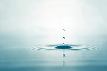 Water droplets on surface water background