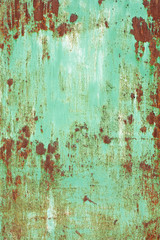 old rusty metal peeling off painted surface texture with spots closeup view