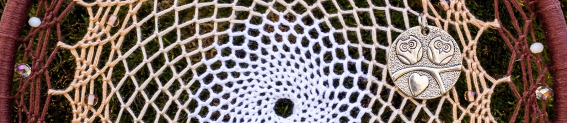 Banner of Handmade dream catcher with feathers threads and beads rope hanging
