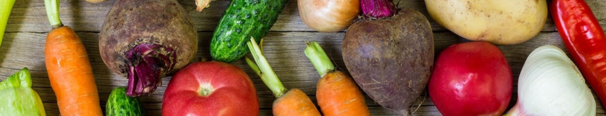 Banner of Different colorful vegetables all over the wooden table in full frame. Healthy eating