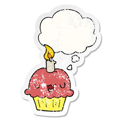 cartoon cupcake and thought bubble as a distressed worn sticker