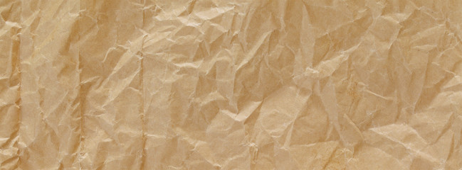 close up shot of light brown crumpled recycled paper texture for banner background