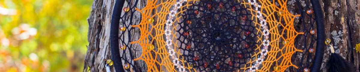 Banner of Handmade dream catcher with feathers threads and beads rope hanging