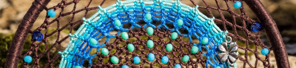 Banner of Handmade dream catcher with feathers threads and beads rope hanging