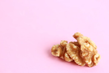 Peeled walnuts in colorful background
