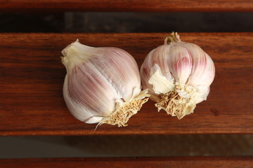 head of garlic on wooden background