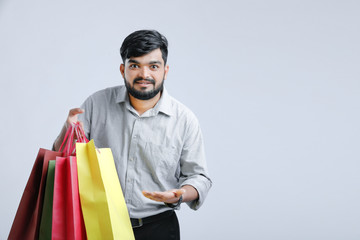 Young indian man with shopping bags