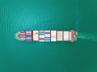 Aerial top view container ship on the sea for logistics, import export, shipping or transportation.