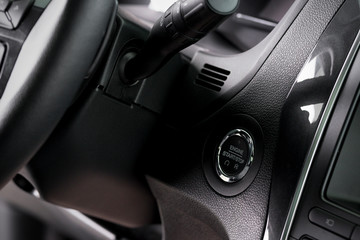 Obraz na płótnie Canvas close up start stop button and windscreen wiper switch inside a new car