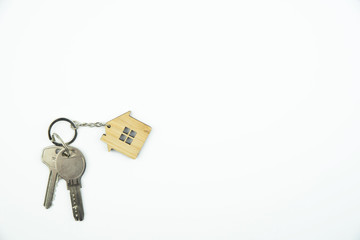 Buying a house, building repair and mortgage concept. Estimation real estate property with loan money and banking. Plan of a house, keys on white background. 