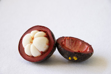 Mangosteen Thai popular fruits - a tropical fruit with sweet juicy white segments of flesh inside a...