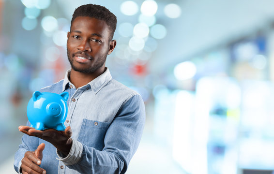 Businness Black Man With Piggy Bank. Money Saving Concept