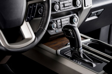 Pickup truck with the most luxurious interiors, automatic gear lever close up, designed for...