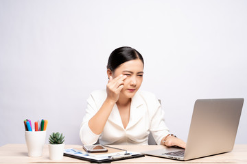 Woman has eyes pain at office isolated over white background