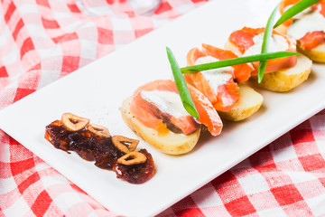 Salad of salted salmon, boiled potatoes close up