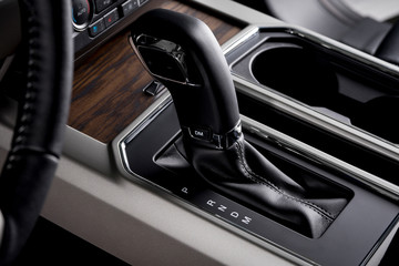 Car interior with automatic transmission, close up gear lever - luxurious details