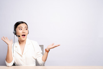 Woman operator in headset with blank copy space isolated white background