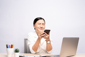 Portrait of happy woman used smartphone at office isolated over background