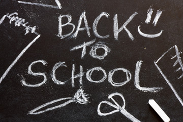 Back to school text on blackboard