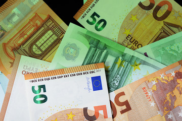 One Hundred and Fifty euro banknotes green color toned close up