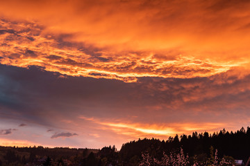 Dramatic orange sky with clouds at sunset. It can be used as a background