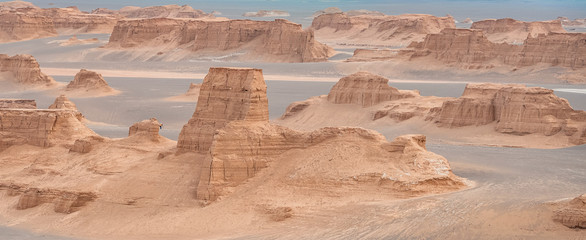 unsurpassed landscapes of sandy rocks in Dasht-e-Lut, Lut desert,hottest desert in the world, also...
