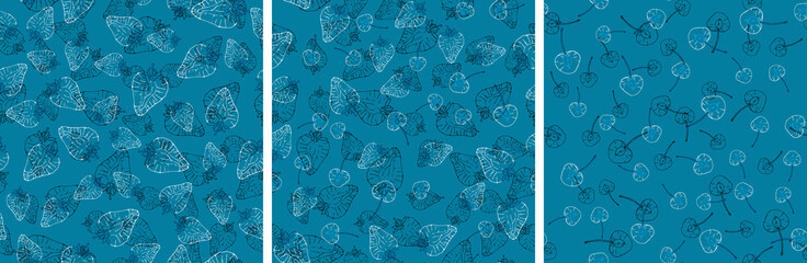 Set of vector seamless pattern with fruit slices. Cherries and strawberries on a blue background